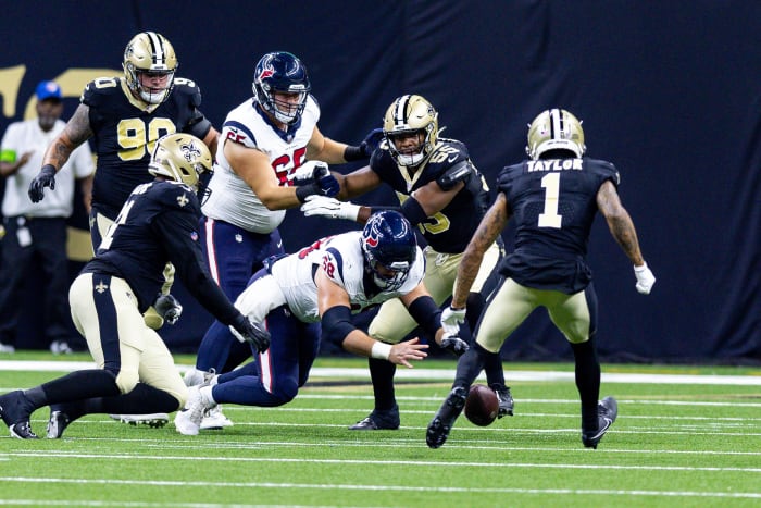 Texans center Jarrett Patterson recovers a fumble against the New Orleans Saints during the first half at the Caesars Superdome.